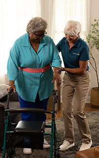 Image of a Visiting Angels caregiver providing support to an elderly person.